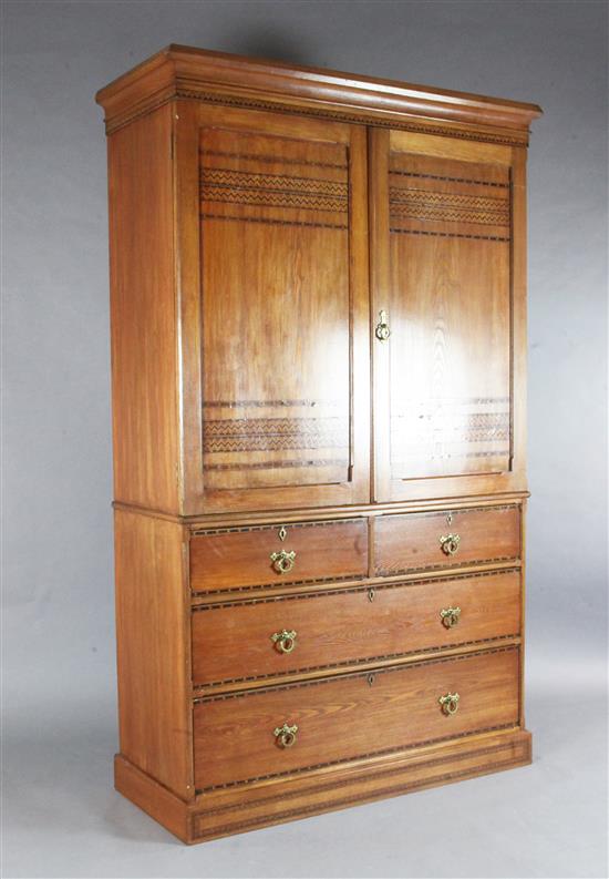 A Victorian Arts & Crafts ash and marquetry bedroom suite, by Heal & Son, triple wardrobe W.6ft1.5in.